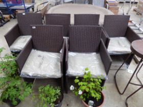 6 brown rattan garden armchairs each with beige coloured cushions