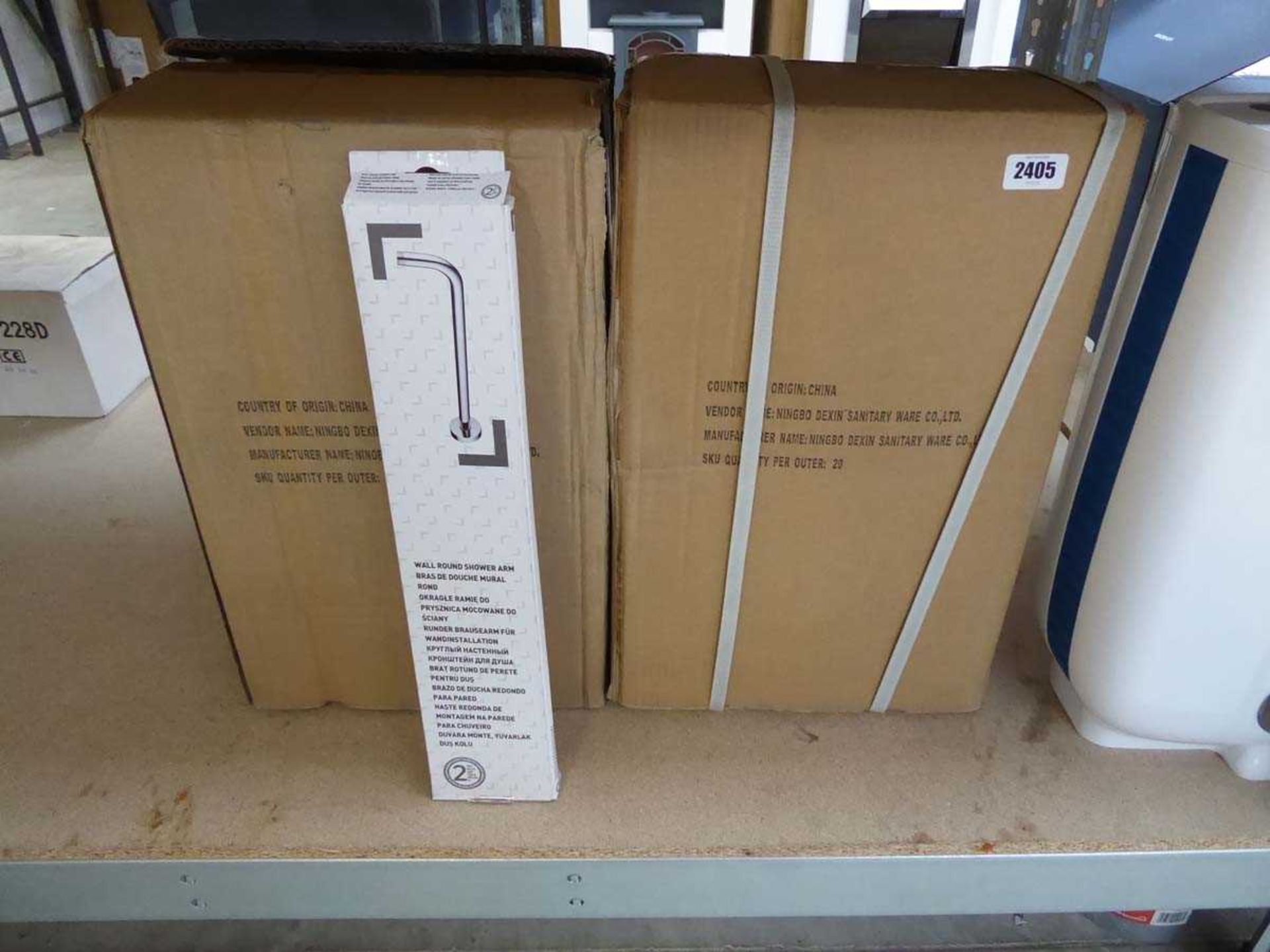 2 boxes containing 40 wall round shower arms