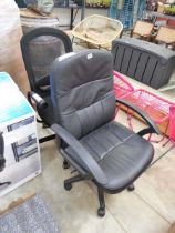 2 black various style office chairs