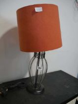 Glass effect lamp shade with orange shade