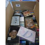 Box containing a quantity of cassettes to include Elvis Presley, Dolly Parton etc.