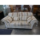 Two x 2 seater sofas in cream striped pattern