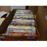 Tray containing various children's DVDs