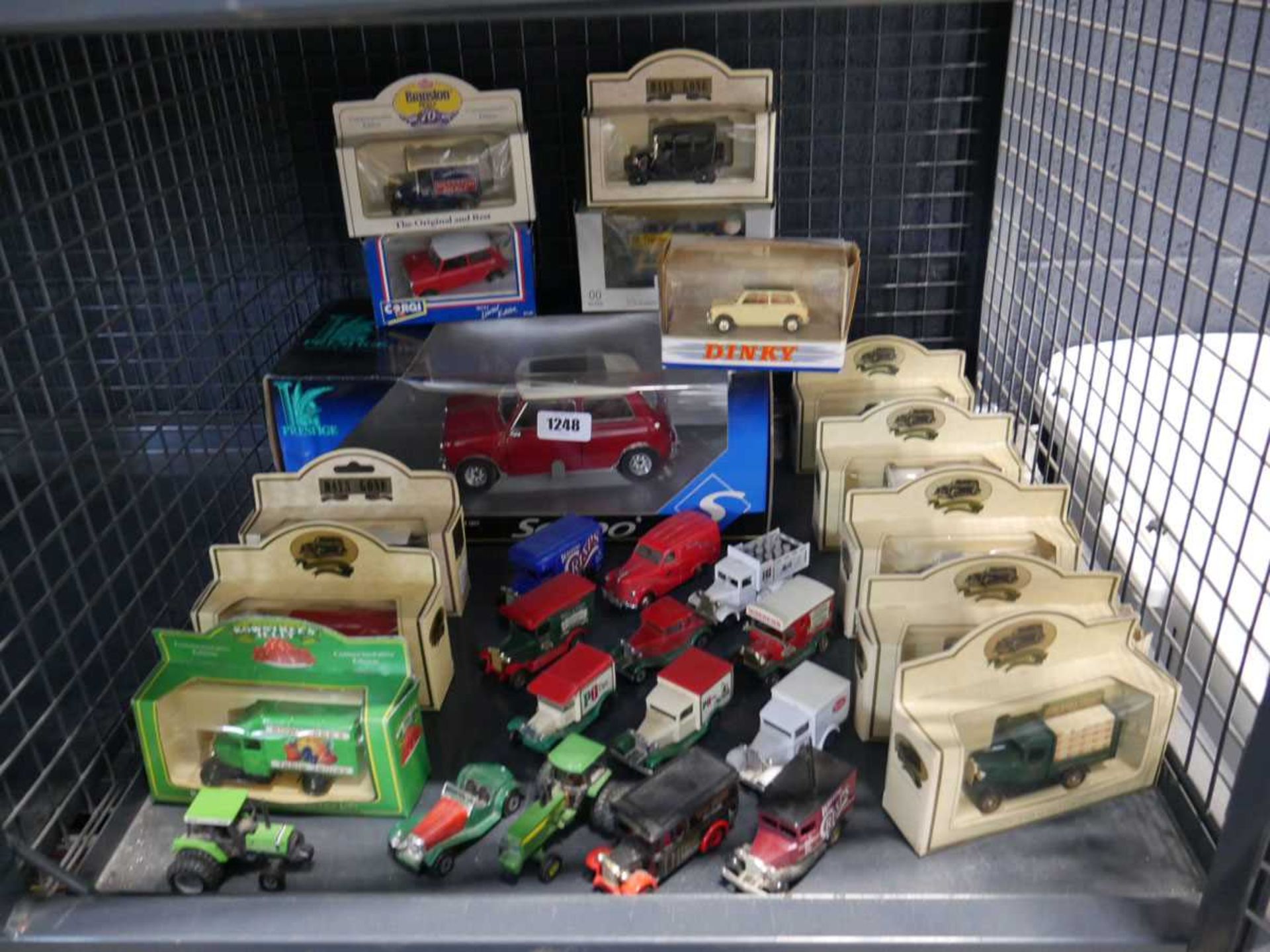 Cage containing various model cars to include promotional models, Prestige, Dinky and others