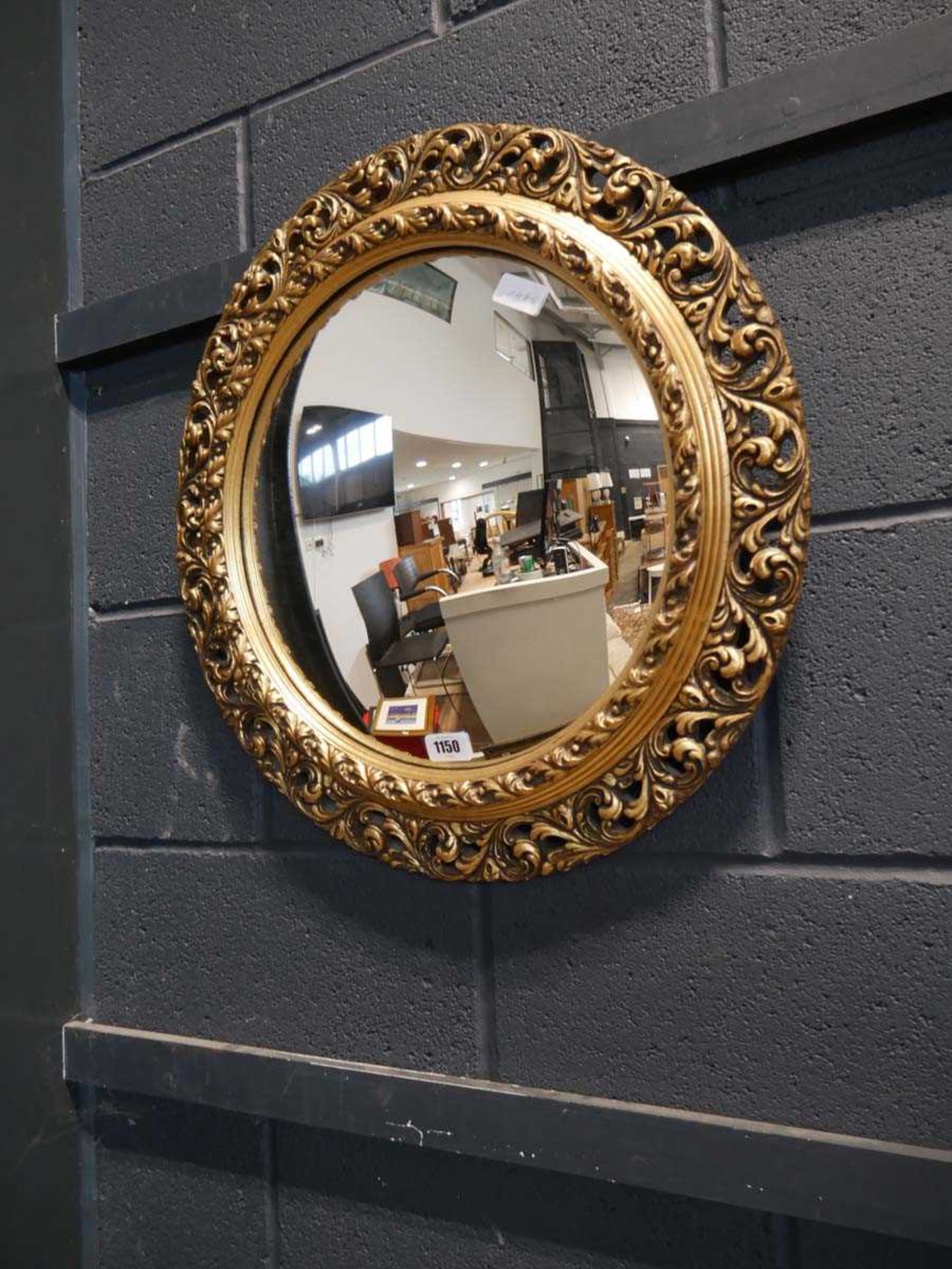 Ornate gold coloured convex mirror