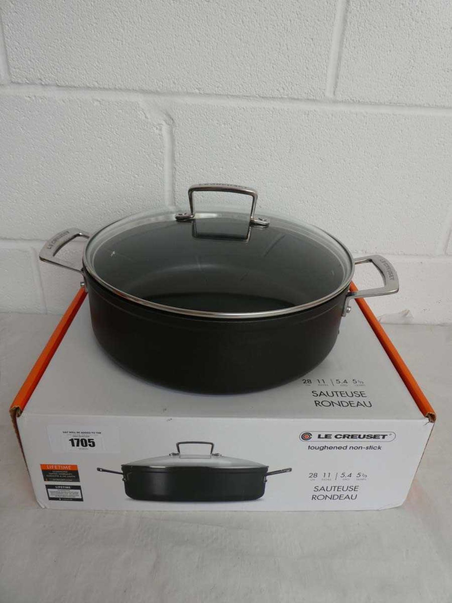 +VAT Le Creuset lidded sauteuse pan (28cm) in black, boxed