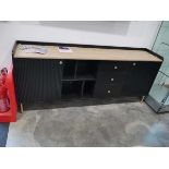 Long black and light wood wall unit with 2 cupboards, 3 drawers and open shelving space