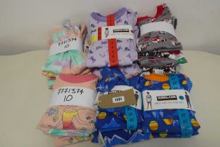 Bag of childrens of 4 piece pyjama sets by Kirkland.