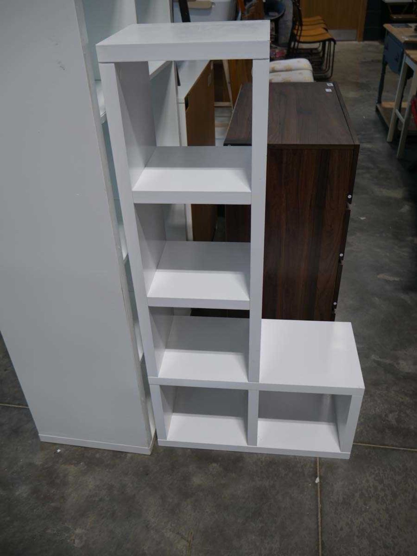 Small white shelving unit together with a white kallax style shelving unit