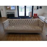 +VAT Modern light grey sofa on brushed chrome tapered supports upholstered in button back finish