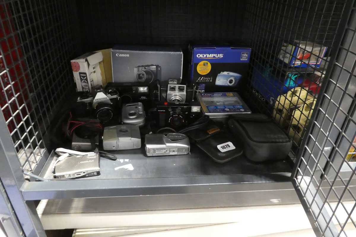 Box containing various vintage and digital cameras to include Nikon, Kodak, Olympus, Canon, etc