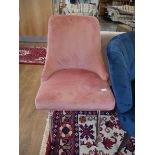 Pink suede upholstered dining chair on chrome tapered supports