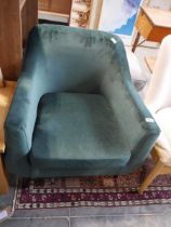 Green suede upholstered easy chair