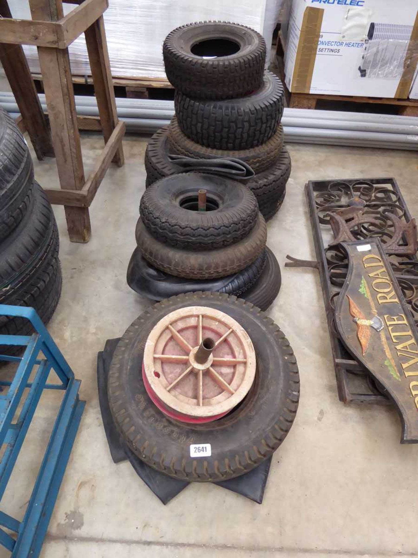 Large quantity of various size tyres, tubes and a wheel