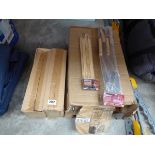 Box containing BBQ utensils with 2 boxes of BBQ skewers