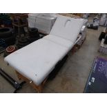 White leatherette collapsible massage bed with carry case