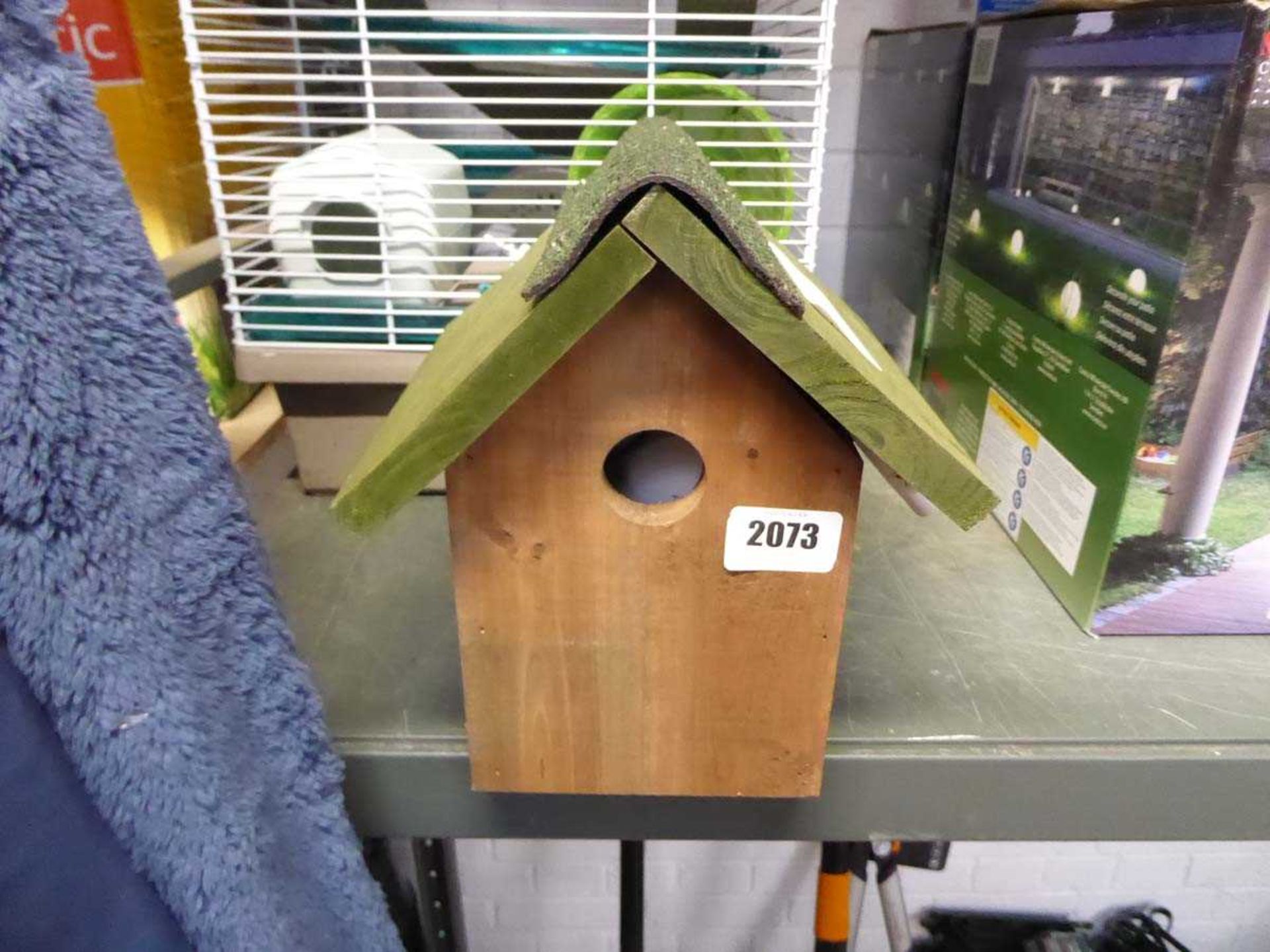 Wooden bird house with integrated camera