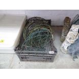 Crate containing various wire hanging baskets