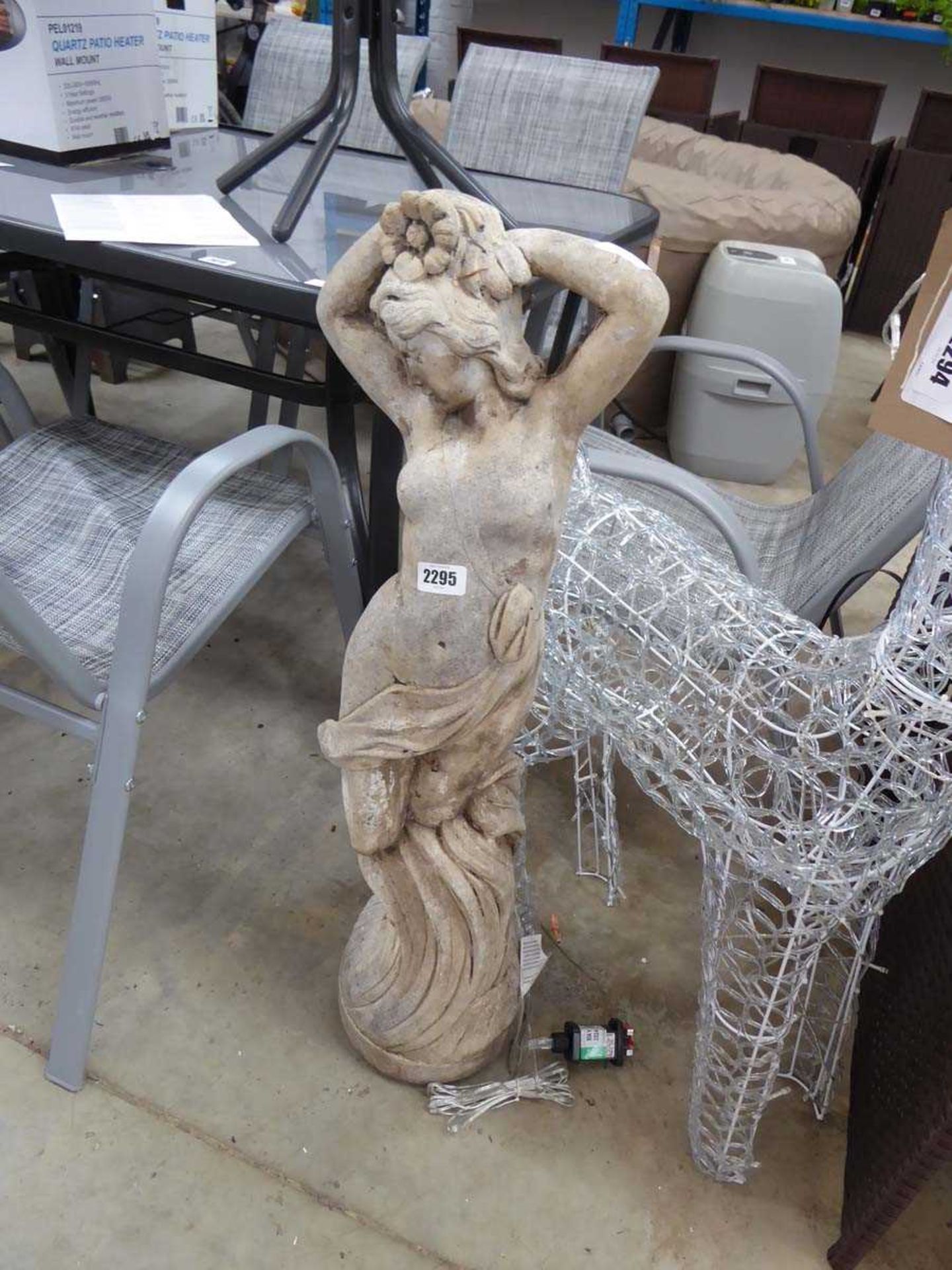Decorative concrete figurine in the form of a lady