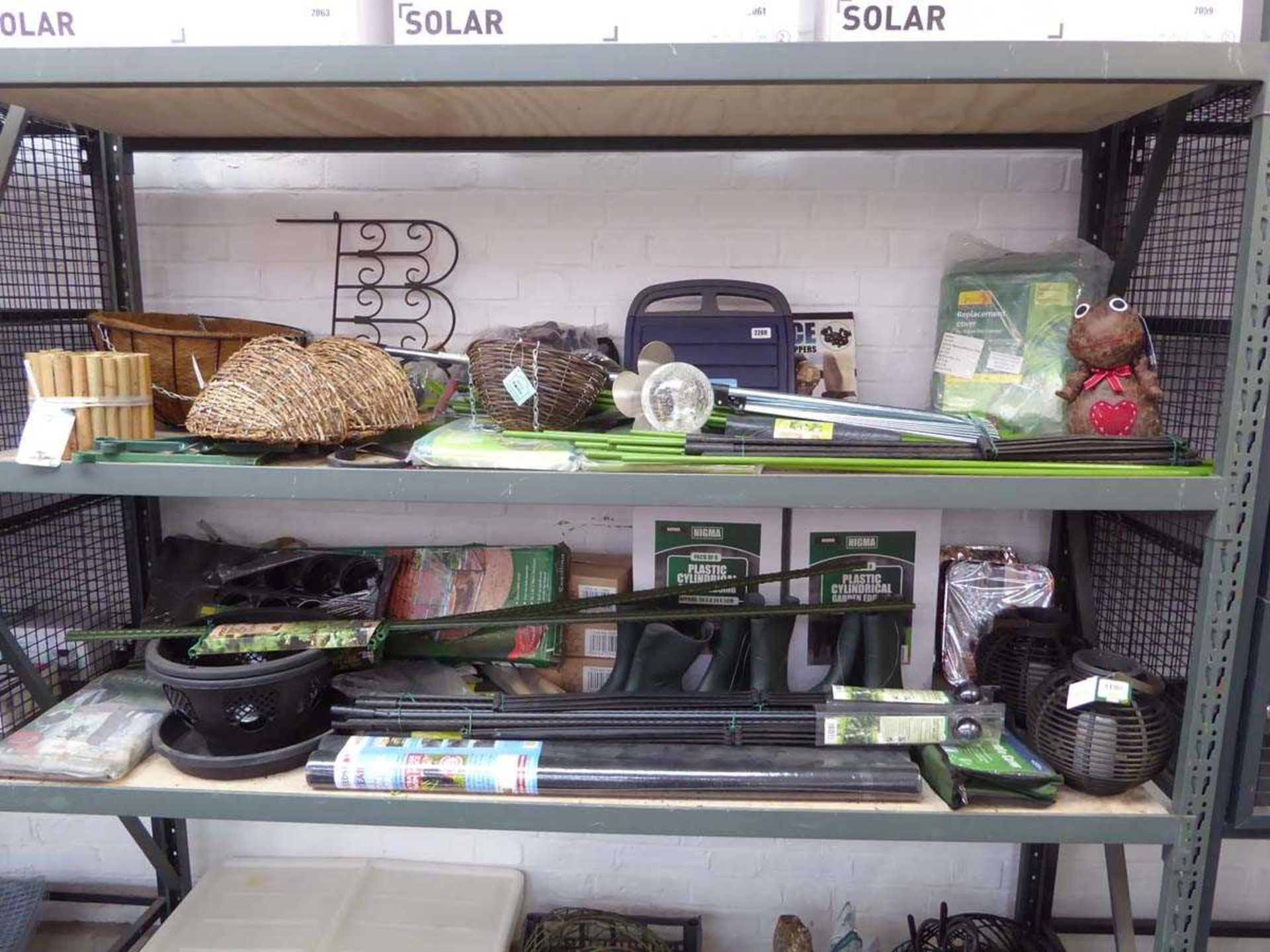 2 bays of mixed gardening related items incl. weed control fabric, tomato plant support frames,