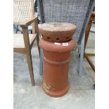 Terracotta chimney pot with topper