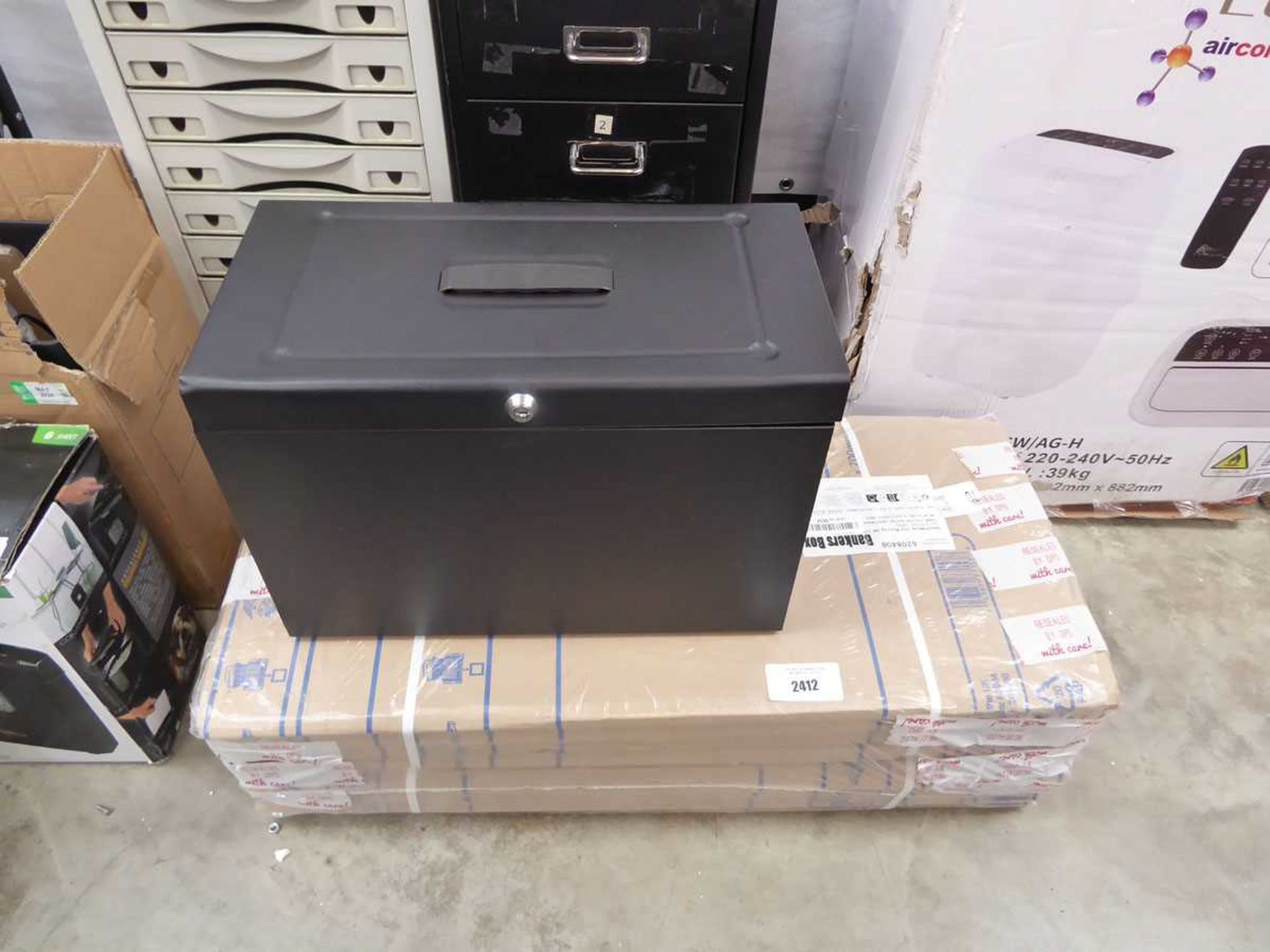 +VAT Quantity of flat pack cardboard boxes with black metal lockable chests
