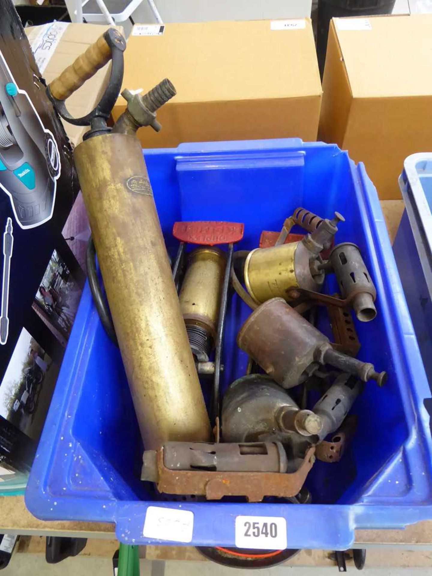Crate of vintage paraffin flame guns, 2 vintage single barrel foot pumps and vintage hand pump