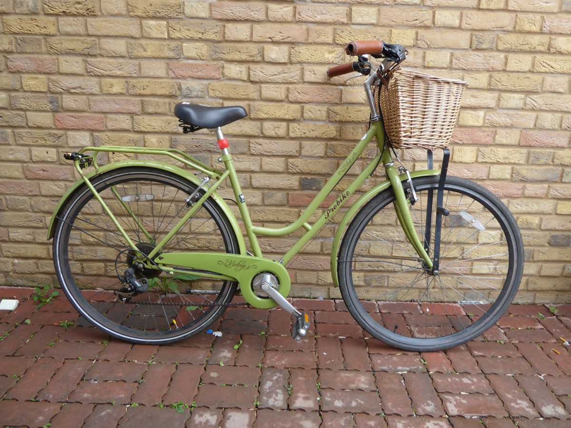 Ladies vintage ProBike in green with basket on front