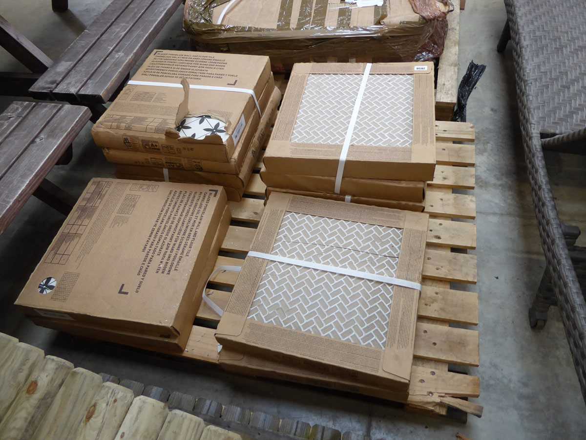 Pallet containing 12 boxes of white and black mosaic ceramic floor tiles