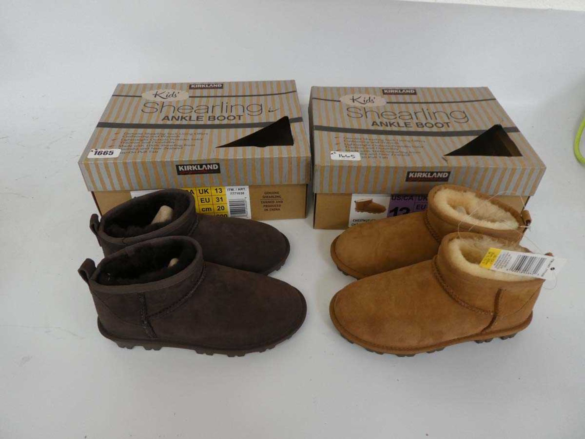 2 boxed pairs of kids kirkland shearling ankle boots - one chestnut, one brown - both size UK 13