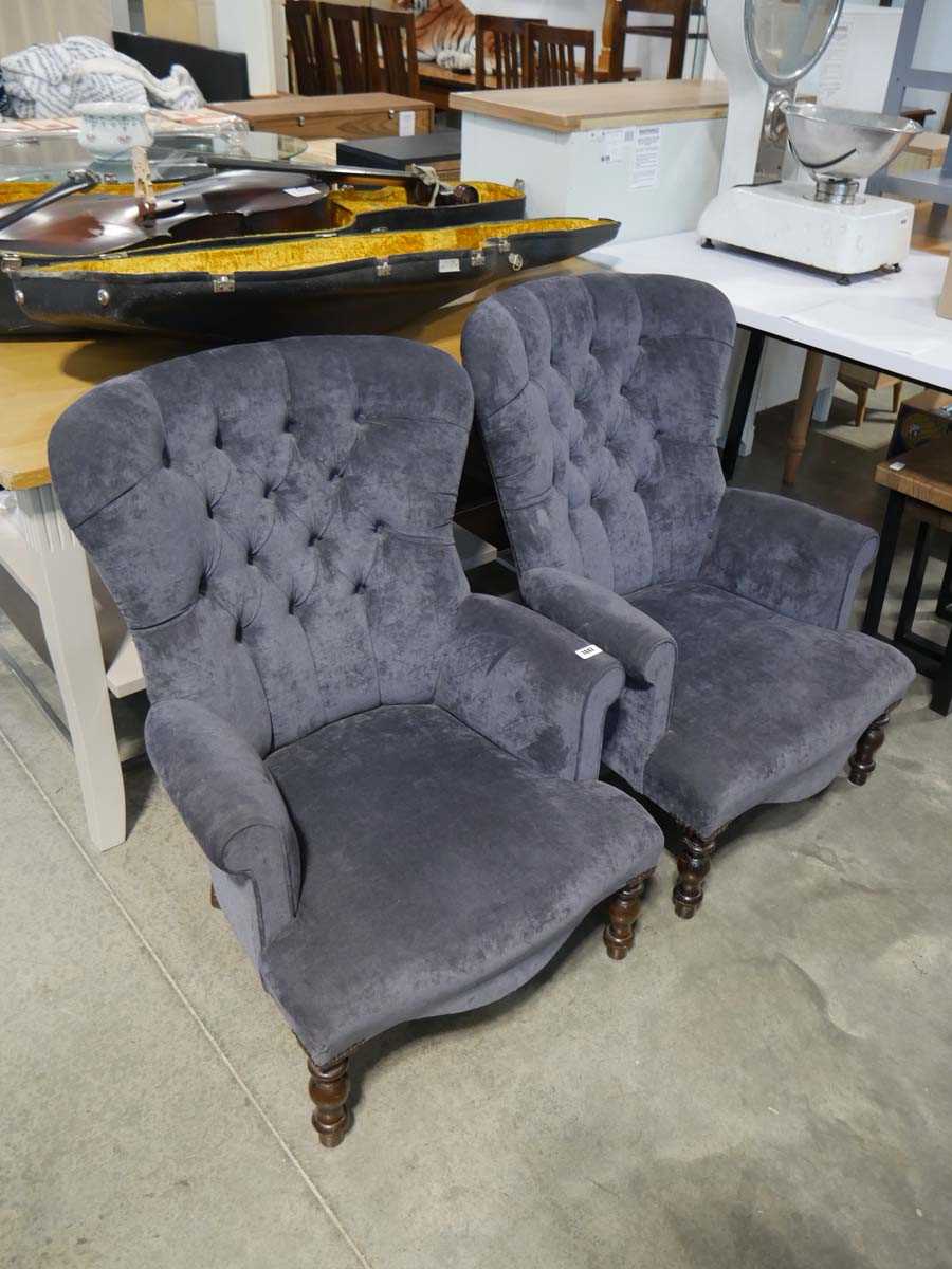 Pair of navy blue button back upholstered easy chairs on turned wooden supports