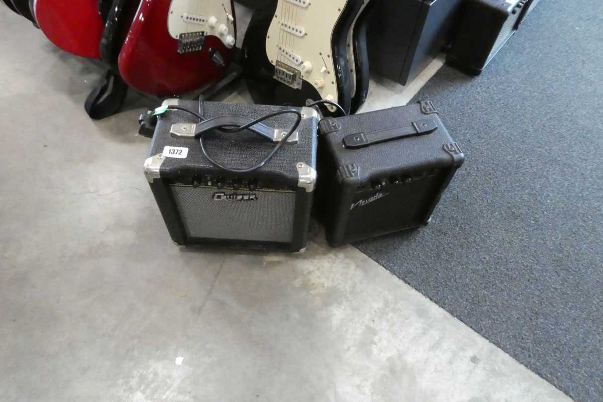 2 electric guitar amplifiers, 1 Cruiser by Crater and 1 Nevada
