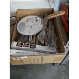 Tray containing various kitchen items to include pizza paddle, tongs, BBQ grill mats, BBQ