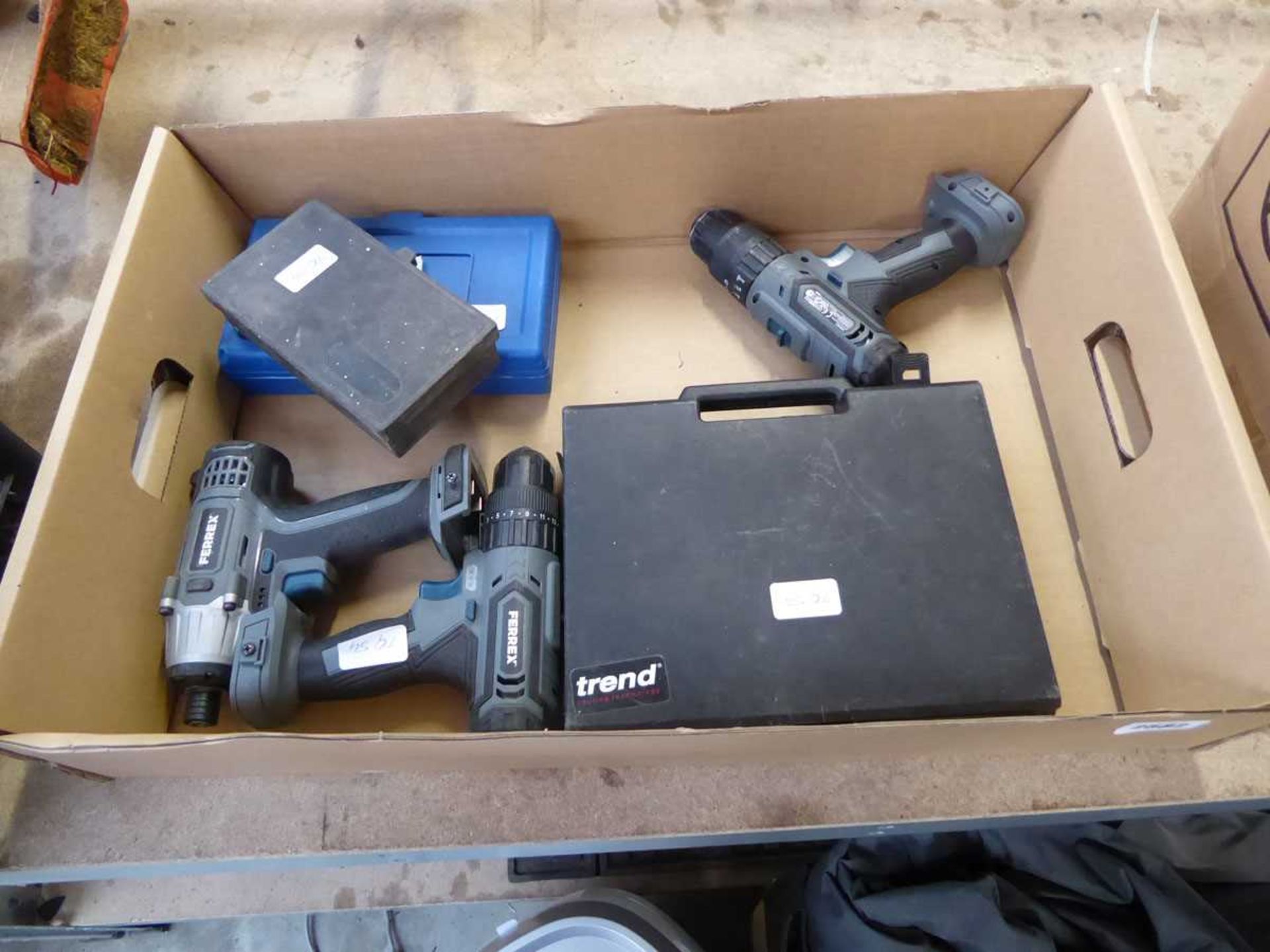 Box containing 3 Ferrex cordless drills, cased Trend, pipe cutting kit, etc.