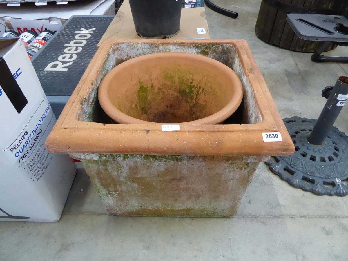 Large square terracotta pot with large circular terracotta pot