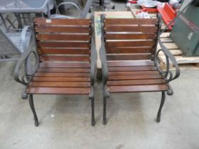 Pair of wooden slatted metal ended garden armchairs