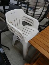 3 white plastic chairs