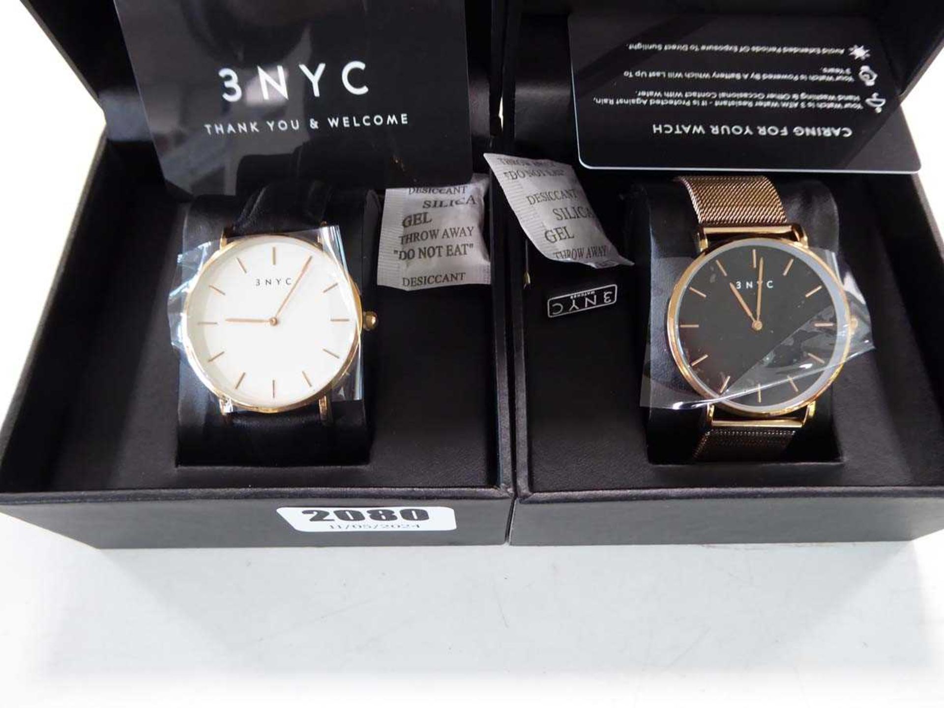 2x 3 NYC wristwatches, 1 with black strap and white face and 1 with golden strap and black face - Image 2 of 2