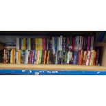 Half shelf of fiction books