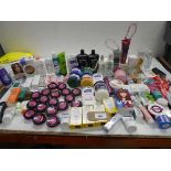 +VAT Large bag of toiletries including body wash, serum, sun protection, body butter, hair products,