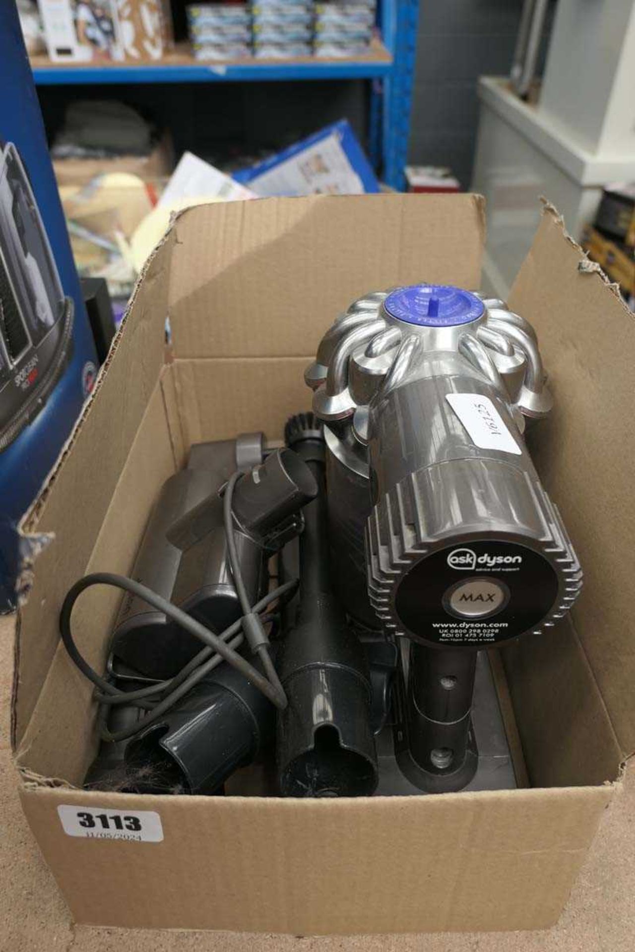 Hand held Dyson DC58 cordless hoover with charger, and attachments but no pole or head