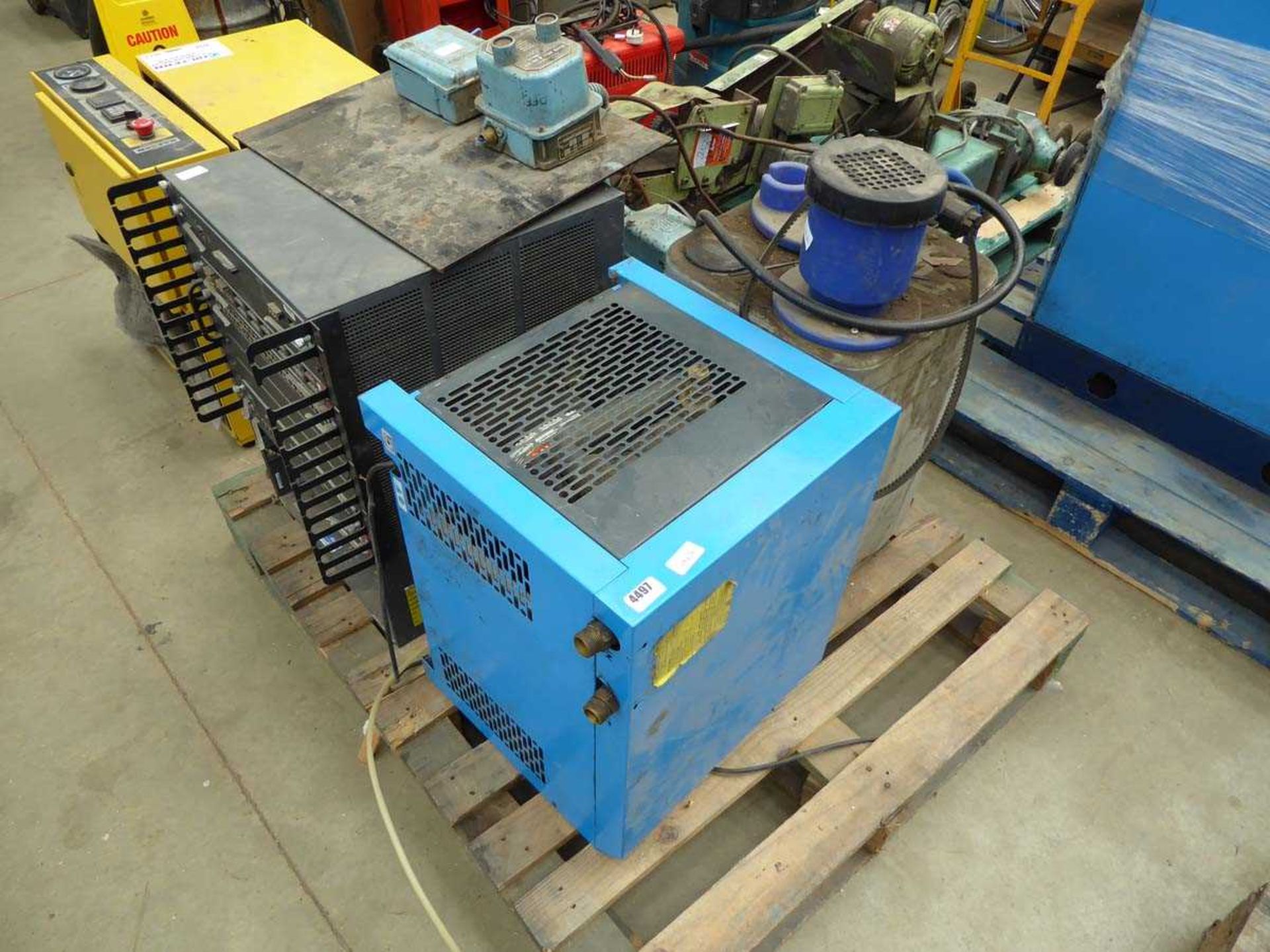 Pallet containing machine parts and motors