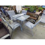 Square glass topped garden table with 4 matching chairs and parasol