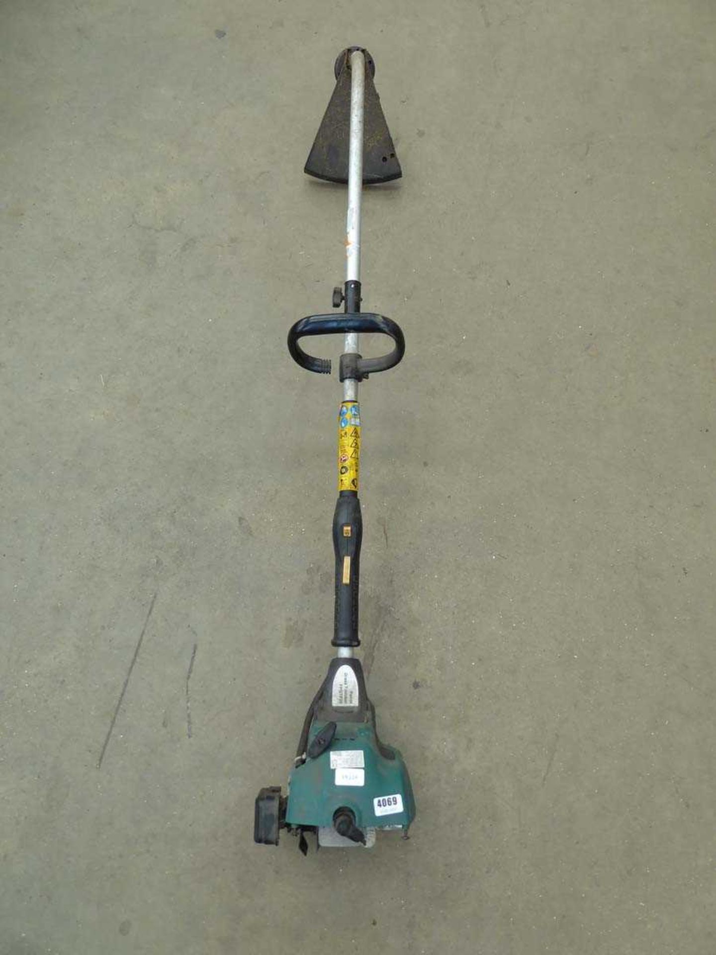 Green petrol powered strimmer (incomplete)