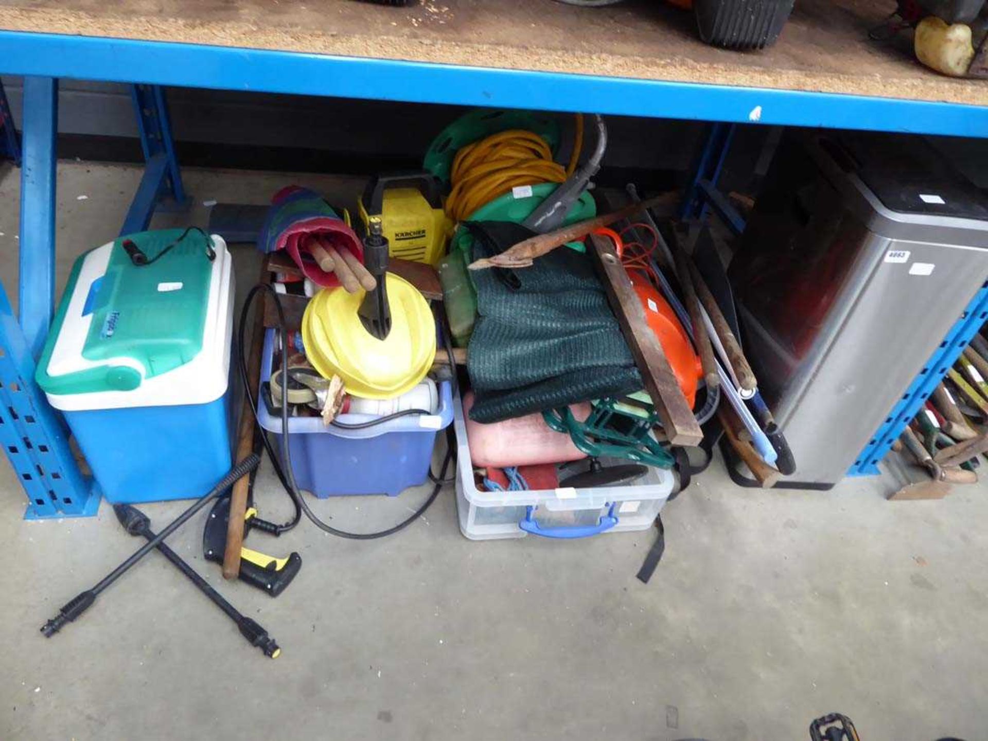 Underbay of assorted items inc. leaf blowers, Karcher pressure washers, coolboxes, tools, mesh etc.
