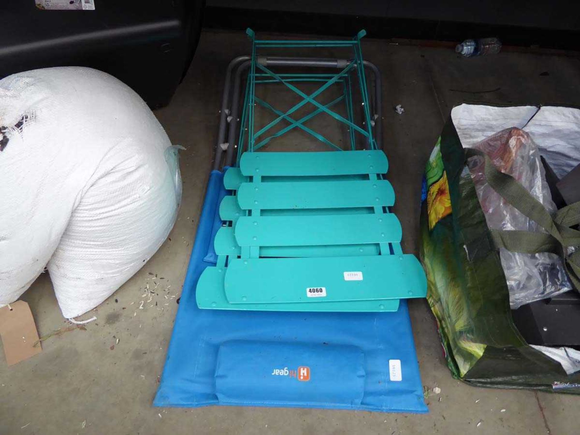 2 green foldup chairs and a HighGear chair