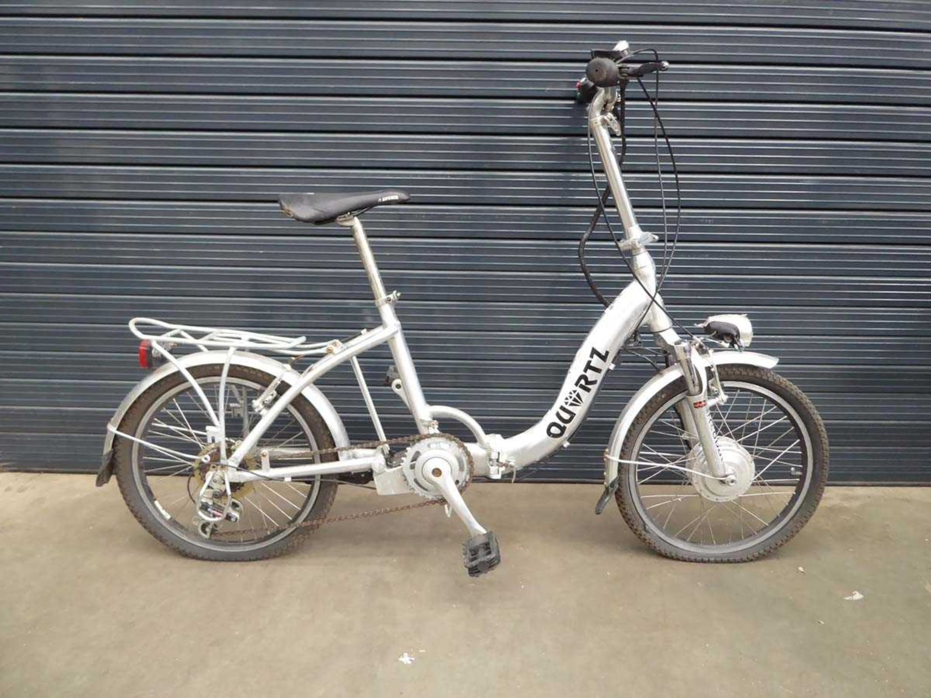 Foldup silver battery powered bike, no battery or charger