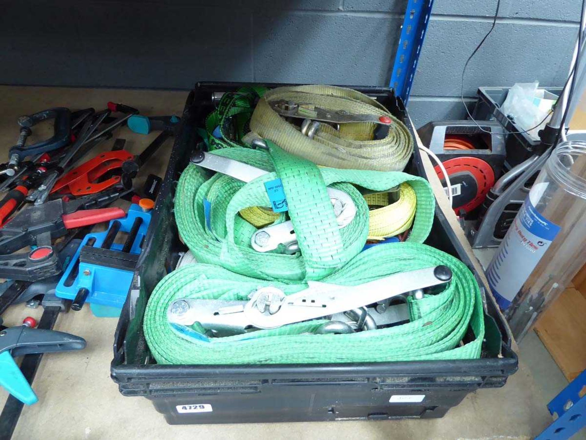Plastic crate of used lorry straps