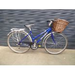 Blue Raleigh ladies bike with front basket and rack