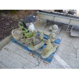 Pallet of concrete garden ornaments to include man on bench, swan, girl with umbrella etc